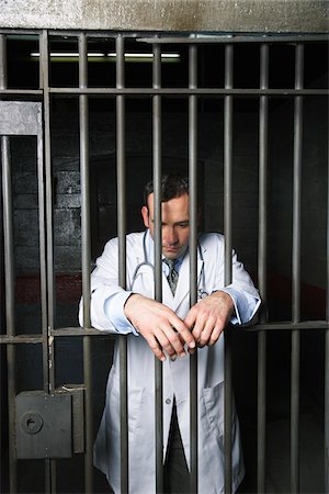 people inside jail cell - Doctor in Prison Stock Photo - Premium Royalty-Free, Code: 600-02201359