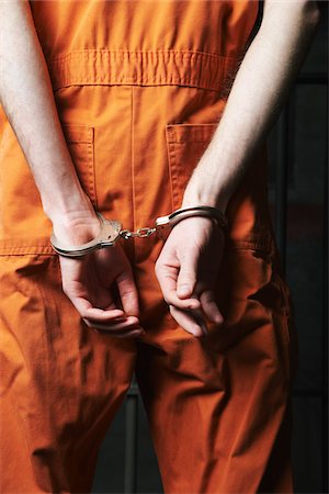 person prison jumpsuit - Prisoner in Handcuffs Stock Photo - Premium Royalty-Free, Code: 600-02201374