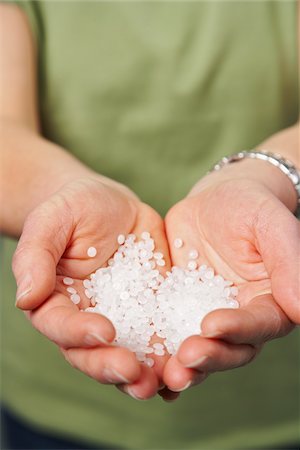 simsearch:700-00748140,k - Hands Holding Plastic Polymer Pellets Stock Photo - Premium Royalty-Free, Code: 600-02201516
