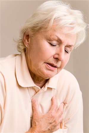 Woman With Chest Pain Stock Photo - Premium Royalty-Free, Code: 600-02244889