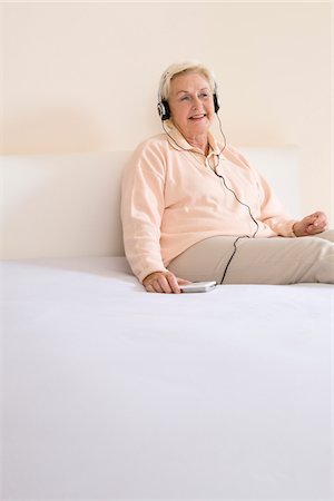 photo of people sit listening to radio - Woman Listening to Music Stock Photo - Premium Royalty-Free, Code: 600-02244899