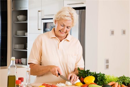 senior only - Woman Slicing Vegetables Stock Photo - Premium Royalty-Free, Code: 600-02245246