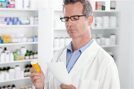 pharmacist (male) - Pharmacist Reading Prescription Stock Photo - Premium Royalty-Free, Code: 600-02245676