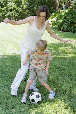 picture of yard soccer game - Mother and Son Playing Soccer Stock Photo - Premium Royalty-Free, Code: 600-02245724