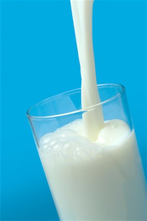 Pouring Milk Into a Glass Stock Photo - Premium Royalty-Free, Code: 600-02264005