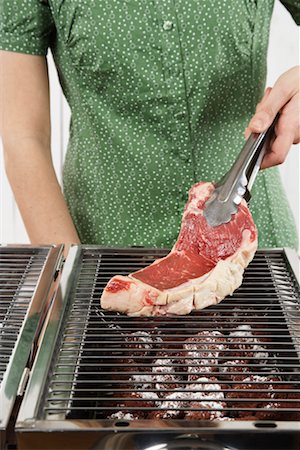 slab (food) - Woman Grilling a Steak Stock Photo - Premium Royalty-Free, Code: 600-02264228