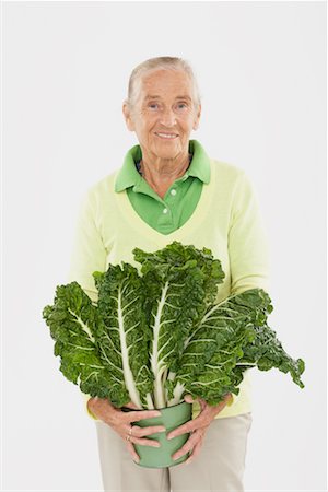 simsearch:600-02265499,k - Portrait of Woman Holding Bunch of Swiss Chard Stock Photo - Premium Royalty-Free, Code: 600-02265505