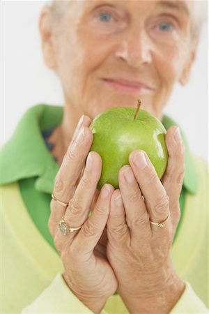 simsearch:600-06452128,k - Close-Up of Woman Holding Apple Stock Photo - Premium Royalty-Free, Code: 600-02265515