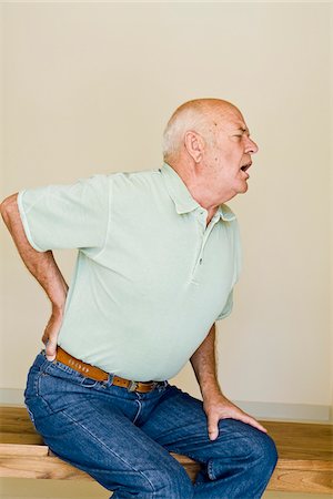 person sitting on the bench back - Man with Back Pain Stock Photo - Premium Royalty-Free, Code: 600-02265714