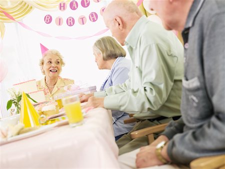 senior woman with cake - Birthday Party at Seniors' Residence Stock Photo - Premium Royalty-Free, Code: 600-02289182