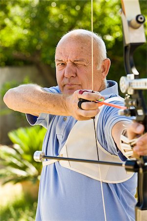 simsearch:700-01248748,k - Man Using Bow and Arrow Stock Photo - Premium Royalty-Free, Code: 600-02290064