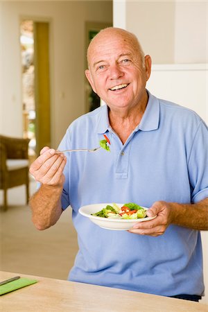 simsearch:600-02290061,k - Portrait of Man Eating Salad Stock Photo - Premium Royalty-Free, Code: 600-02290189