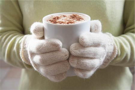 Close-up of Woman Holding Mug of Hot Chocolate Stock Photo - Premium Royalty-Free, Code: 600-02347817