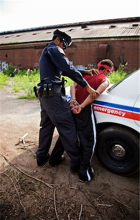 policeman handcuff - Police Officer Arresting Suspect Stock Photo - Premium Royalty-Free, Code: 600-02348045