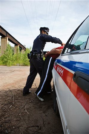 Police Officer Arresting Suspect Stock Photo - Premium Royalty-Free, Code: 600-02348049