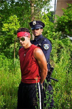 Police Officer Arresting Suspect Foto de stock - Sin royalties Premium, Código: 600-02348042