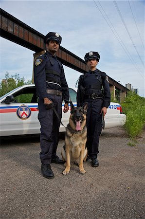 female police officers uniform - Portrait of Police Officers With Police Dog Stock Photo - Premium Royalty-Free, Code: 600-02348060