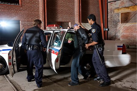 Police Officers Arresting Suspects Foto de stock - Sin royalties Premium, Código: 600-02348092