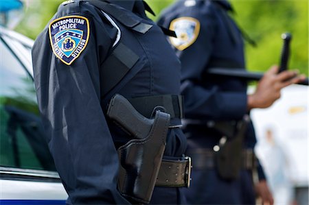 policewoman - Close-up of Police Officer's Gun Stock Photo - Premium Royalty-Free, Code: 600-02348116