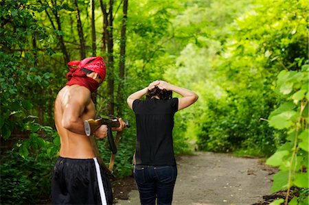 Man Pointing Gun at Hostage Stock Photo - Premium Royalty-Free, Code: 600-02348129