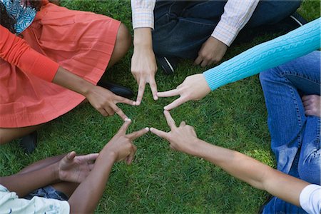 four human hands joined in unity - Group of Teens Making a Star Stock Photo - Premium Royalty-Free, Code: 600-02348548