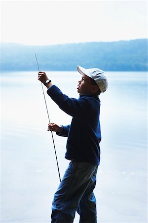 Boy Adjusting Fishing Rod, Algonquin Park, Ontario, Canada Foto de stock - Sin royalties Premium, Código: 600-02348734