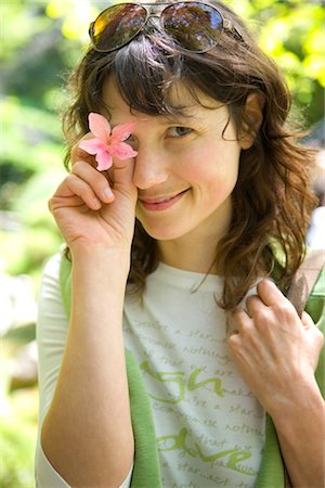 simsearch:600-02346441,k - Portrait of Woman Holding a Flower Over Her Eye, San Francisco, California, USA Stock Photo - Premium Royalty-Free, Code: 600-02376679