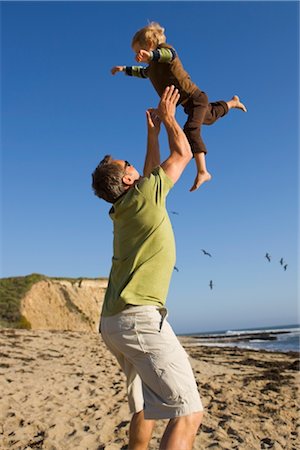 simsearch:700-01954107,k - Father and Son Playing on the Beach, Santa Cruz, California, USA Stock Photo - Premium Royalty-Free, Code: 600-02376686