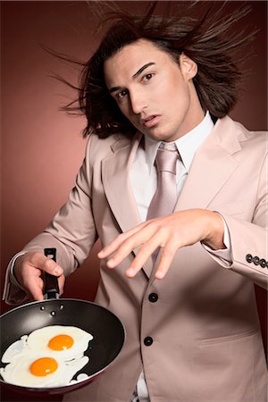Man Holding Frying Pan with Eggs Foto de stock - Sin royalties Premium, Código: 600-02376780