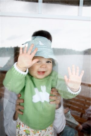 person through a window - Baby Looking Through Ship Window Stock Photo - Premium Royalty-Free, Code: 600-02376849