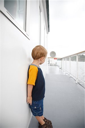 Boy Standing on Deck of Ship Stock Photo - Premium Royalty-Free, Code: 600-02376861
