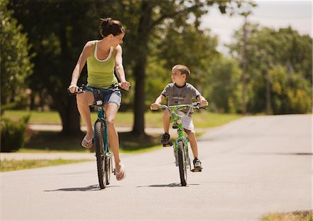 simsearch:700-00054695,k - Woman and Boy Riding Bicycles Stock Photo - Premium Royalty-Free, Code: 600-02377990