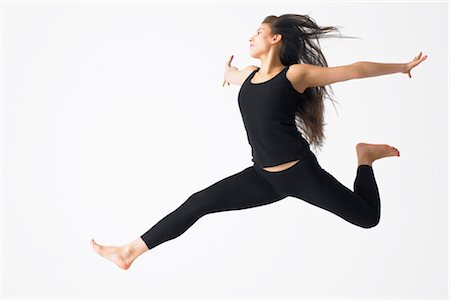 Woman Jumping in Mid-air Foto de stock - Sin royalties Premium, Código: 600-02370942