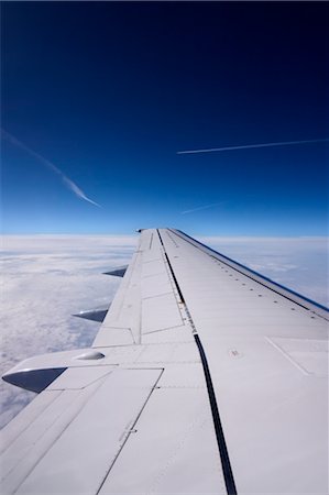 plane above cloud - View of Airplane Wing from Airplane, Europe Stock Photo - Premium Royalty-Free, Code: 600-02428491