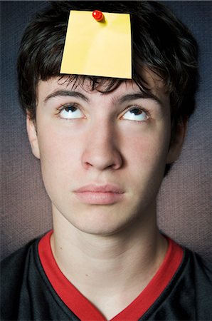 post it flag - Teenager Looking at Blank Note Pinned to his Head Stock Photo - Premium Royalty-Free, Code: 600-02429146