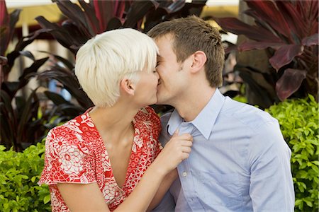 people together candid not office - Young Couple Kissing Outdoors Stock Photo - Premium Royalty-Free, Code: 600-02429157