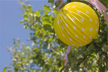 paper lanterns for birthday party - Paper Lantern Decorations at Birthday Party Stock Photo - Premium Royalty-Free, Code: 600-02461305