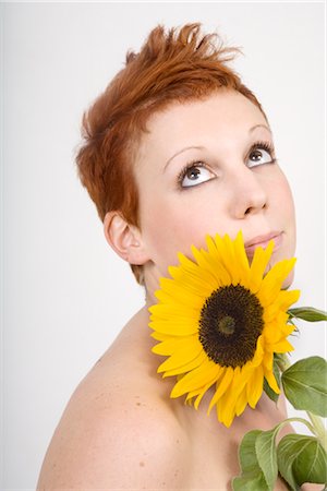 detail of sunflower - Portrait of Woman with Sunflower Stock Photo - Premium Royalty-Free, Code: 600-02504684