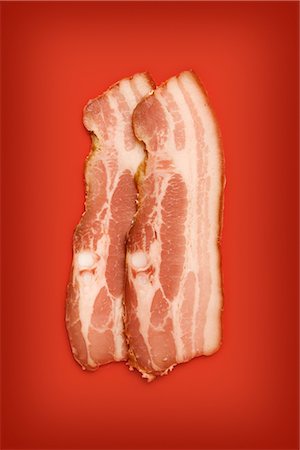 Still Life of Two slices of Uncooked Bacon Stock Photo - Premium Royalty-Free, Code: 600-02504705