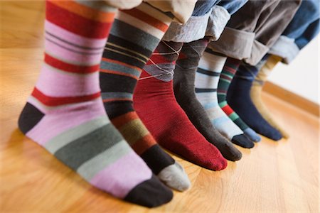 shoes lined up in a row - Close-up of People Wearing Colourful Socks Stock Photo - Premium Royalty-Free, Code: 600-02586034