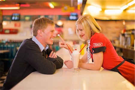 drinking milk shake - Waitress in a Retro Diner Flirting With Customer Stock Photo - Premium Royalty-Free, Code: 600-02586046