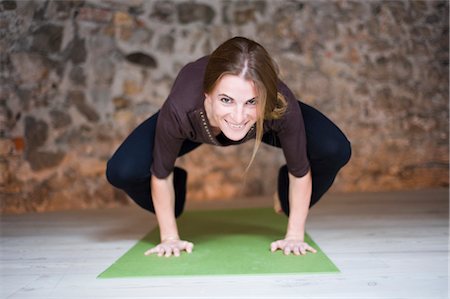 Woman in Yoga Class Doing Crow Pose Stock Photo - Premium Royalty-Free, Code: 600-02594012