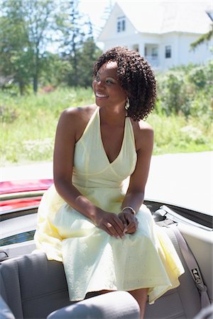 Woman Sitting in Convertible, Niagara Falls, Ontario, Canada Stock Photo - Premium Royalty-Free, Code: 600-02593736