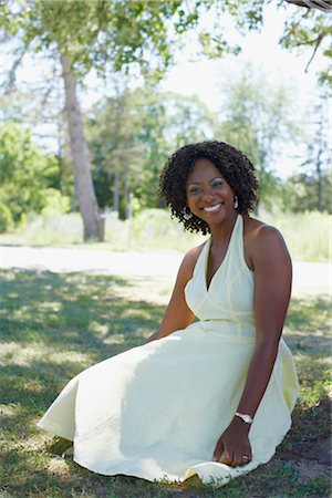 single middle aged african american woman looking at camera - Portrait of Woman, Niagara Falls, Ontario, Canada Stock Photo - Premium Royalty-Free, Code: 600-02593740