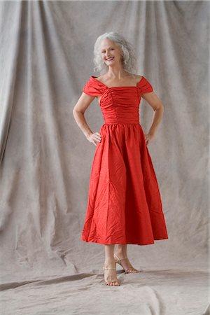 fashion red dress studio shot - Mature Woman Wearing Red Dress Stock Photo - Premium Royalty-Free, Code: 600-02593825