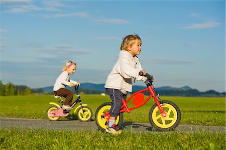 family bike ride - Boy and Girl Riding Bicycles,  Hof bei Salzburg, Salzburger Land, Austria Stock Photo - Premium Royalty-Free, Code: 600-02637524