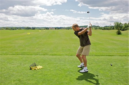driver (golfclub) - Man at Driving Range, Burlington, Ontario, Canada Foto de stock - Sin royalties Premium, Código: 600-02637657