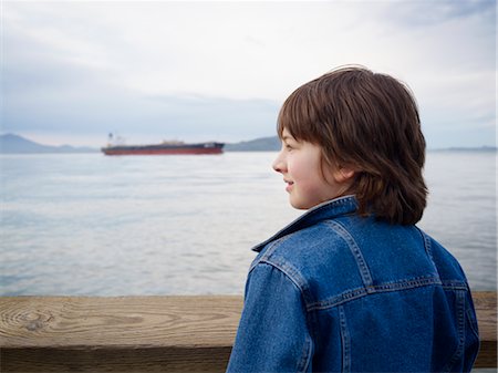 Boy Looking over Water from Pier, San Francisco, California, USA Stock Photo - Premium Royalty-Free, Code: 600-02637686
