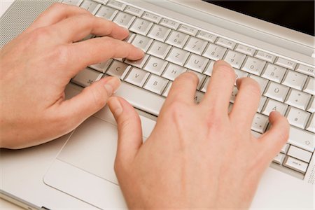 Man's Hands Using Laptop Computer Fotografie stock - Premium Royalty-Free, Codice: 600-02638205