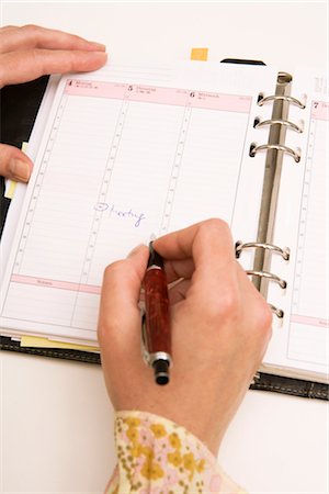 Hands Writing in Day Planner Foto de stock - Sin royalties Premium, Código: 600-02638216